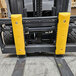 A yellow rectangular Ideal Warehouse Safe-Bump forklift protector with holes in it.
