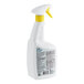 A close-up of a white CLR Pro restroom cleaner spray bottle with a yellow handle.