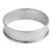 A Gobel stainless steel round tart ring with a circular design.