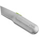 A grey Slice utility knife with a green handle.