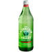 A close up of a green Mountain Valley Spring Water glass bottle with a green label.