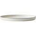 A close up of a Oneida Moira dusted white stoneware plate with a rim.