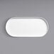 A white oval platter with a raised rim on a white background.