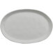 A white cheforward oval melamine plate with a small rim.