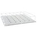 A white metal shelf with metal bars and four compartments on it.