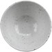 A white cheforward ramekin with black specks.