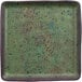 A white cheforward by GET Savor square melamine plate with green and black specks.