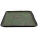 A green square cheforward by GET melamine plate with a speckled surface.