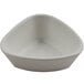 A white cheforward ramekin with a triangle shape.