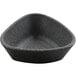A black bowl with a grey and speckled ramekin inside.