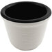 A black melamine ramekin with a white interior and black rim.
