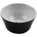 A white ramekin with a black speckled design.