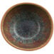 A close-up of a cheforward by GET Savor Clay Azul Iris melamine bowl with a blue and brown speckled surface.
