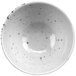 A white cheforward stone ramekin with black specks.