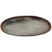 A cheforward oval melamine plate with a woven design on the rim.