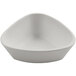 A white cheforward ramekin with a curved edge on a white background.