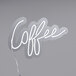 A white Canvas Freaks neon sign that says "Coffee" in white.