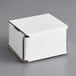 A white Lavex corrugated mailer box on a gray surface.