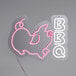 A neon sign that says "BBQ" in neon pink and white letters.