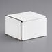 A white Lavex corrugated mailer box on a gray surface.