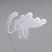 A white neon sign that says "coffee" on it.