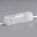 A close up of a clear plastic neon light with white lights inside.