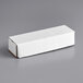A white rectangular Lavex corrugated mailer with writing on it.