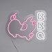 A neon sign that says "BBQ" in pink and white with a pig image.