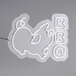 A white neon sign that says "BBQ" with a pig on it.