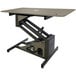 A grey rectangular grooming table with a hydraulic lift mechanism.