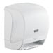 A white automatic paper towel dispenser with a motion sensor.