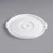 A white plastic lid with a circle in the middle.