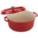 A Spring USA Ironlite red casserole dish with a lid.