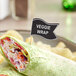 A customizable medium wavy flag pick in a veggie wrap.