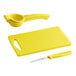 A yellow plastic Choice cutting board with a yellow knife and lemon prep tools.