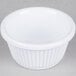 A white Thunder Group fluted melamine ramekin on a gray surface.