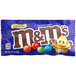 A blue, red, and white M&M's package with a close-up of M&M's Caramel candies inside.