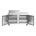An Avantco stainless steel refrigerator with two open doors.