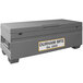 A grey Durham Mfg job site box with a white label.