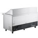 An Avantco stainless steel commercial sandwich prep table with wheels.