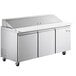 An Avantco stainless steel refrigerated sandwich prep table with three doors.