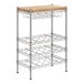 A metal rack with three shelves and a wood top.