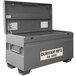 A large grey steel Durham job site box with the lid open.