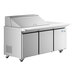 An Avantco stainless steel refrigerator with three doors on a commercial kitchen workstation.