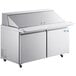 An Avantco stainless steel refrigerated sandwich prep table with two doors and a cutting board.