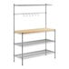 A chrome wire shelf with two wood shelves and a wood top.