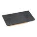 A black rectangular cast iron steak weight with a wooden handle.