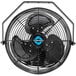 A close up of a black Tornado high-velocity wall fan with a blue logo.