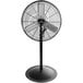 A black Tornado industrial pedestal fan on a white background.