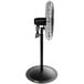A Tornado industrial black metal pedestal fan on a white background.